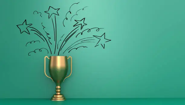 Golden trophy in front of green wall with stars drawn on it to represent the winning joy