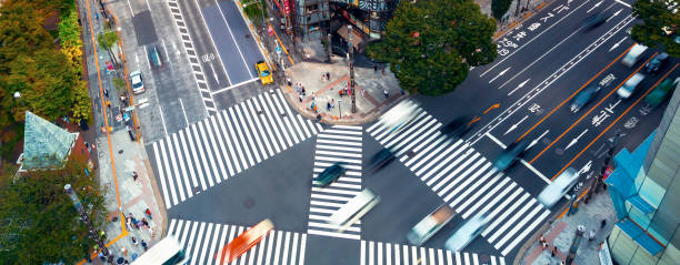 istock Traffic and people cross a busy intersection in Ginza 1324440721