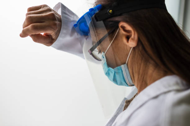 istock Sad, sick, overworked, female health care worker 1324443168