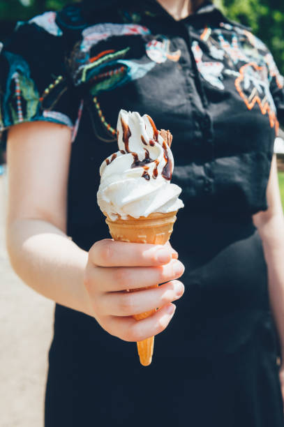 istock Soft vanilla ice cream with chocolate stick 1324447534