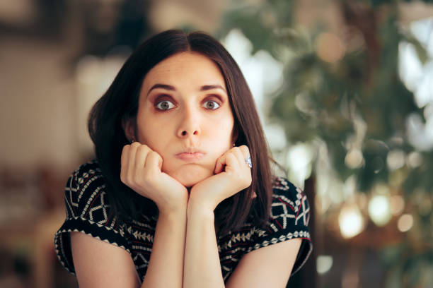 istock Funny Bored Woman Sitting in a Restaurant 1324458865