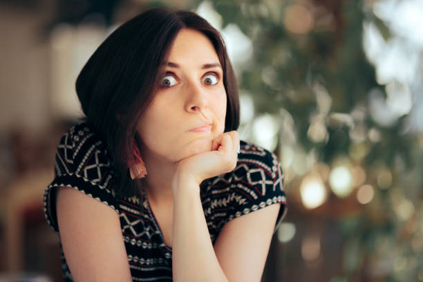 istock Funny Bored Woman Sitting in a Restaurant 1324458868