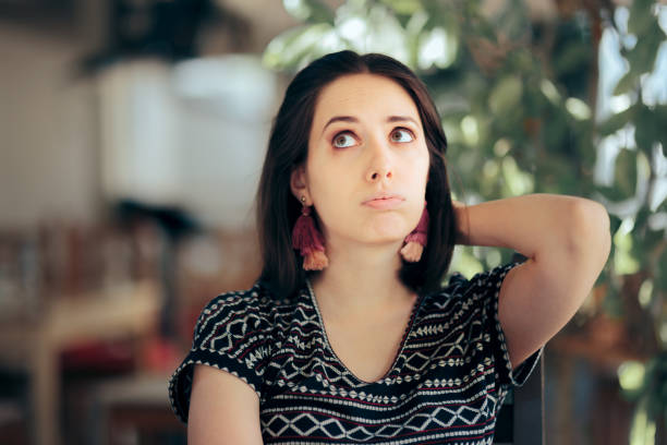 istock Funny Bored Woman Sitting in a Restaurant 1324458873