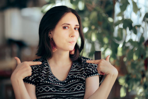 istock Smug Selfish Vain Woman Pointing to Herself 1324458875