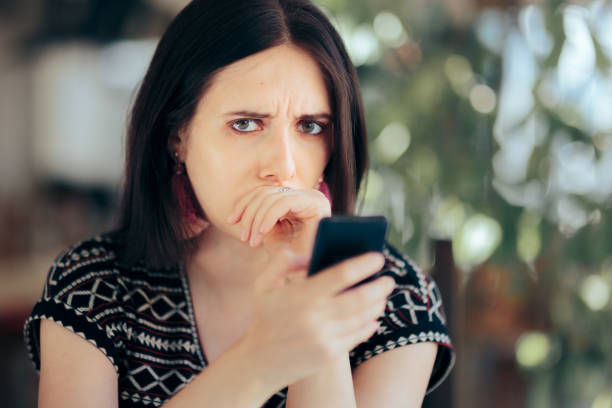istock Worried Sad Woman Reading Text Message on her Phone 1324458884