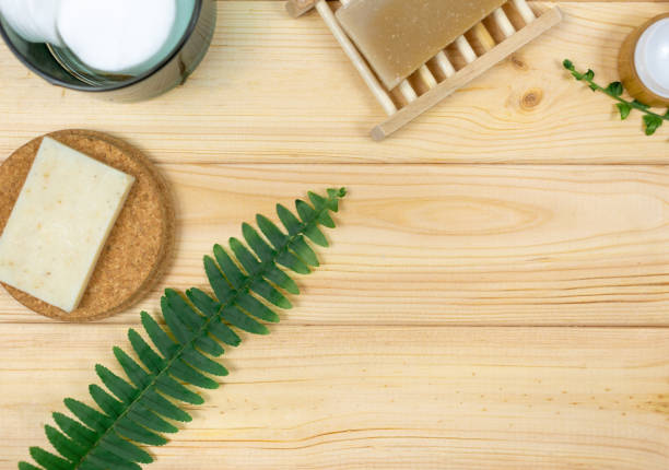 istock Natural soap, ear sticks, brushes with bamboo leaves on wooden table. Top view, flat lay. Sustainable lifestyle, Zero waste cosmetics concept. 1324458964