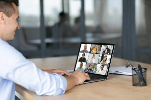 istock Group brainstorm concept, Caucasian employee uses laptop computer for online meeting with diverse multiracial colleagues sitting at the workplace 1324459680