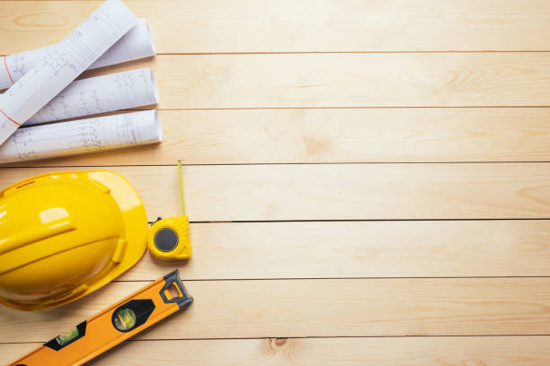istock Work safety. Standard Construction site protective equipment on  top view wooden background, flat lay, copy space,safety first concepts. 1324465750