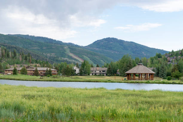 Morning View of Lake and Surrounding Mountains in Deer Valley Near Park City Utah This shot was taken in Deer Valley near Park City, Utah.  Visible in the distance is a small lake and the surrounding mountains. This shot was taken on a summer morning. deer valley resort stock pictures, royalty-free photos & images