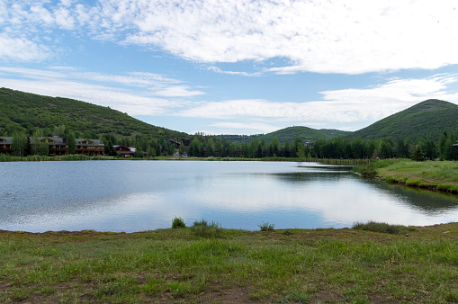 This shot was taken in Deer Valley near Park City, Utah.  Visible in the distance is a small lake and the surrounding mountains. This shot was taken on a summer morning.