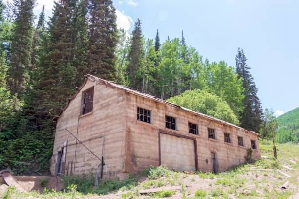Abandoned Mining Building Surrounded by a Green Mountain Forest