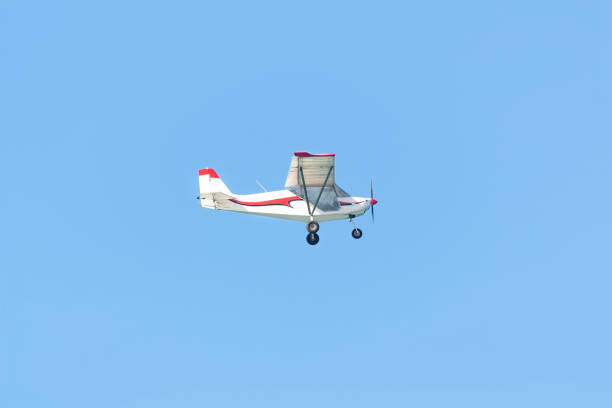 istock A small pleasure plane flying in the blue sky 1324466627