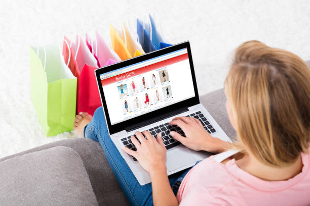 istock Young Woman Sitting On Sofa Using Laptop 1324469613