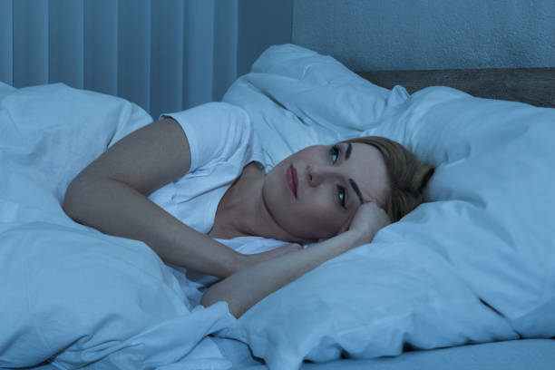 istock Woman In Bed Suffering From Insomnia 1324470437