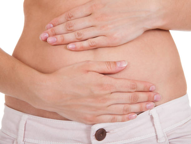 istock Close up of woman's hands on belly 1324470709