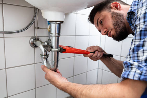 istock Plumber Repairing Sink In Bathroom 1324470735