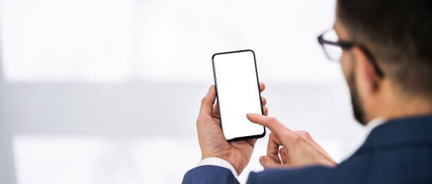 istock Man Holding Mobile Phone 1324470763