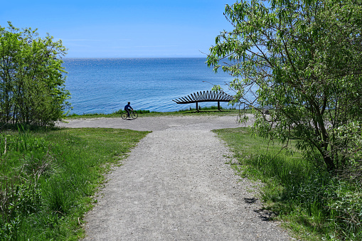 Toronto, Canada - May 27, 2021: Waterfront bicycle and hiking trail beside Lake Ontario near Toronto