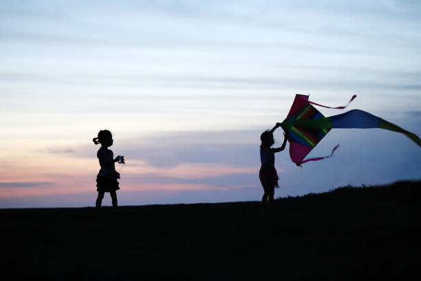 istock silhouette of father and daughter 1324479699