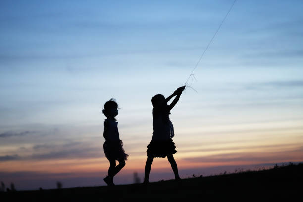 silhouette of father and daughter