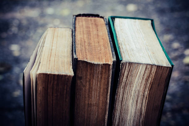 istock Ancient books on a wooden table , literacy and knowledge concept 1324482020