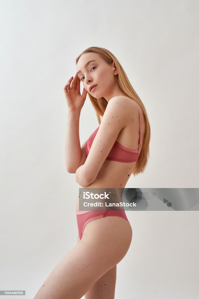Beautiful Young Caucasian Female Model With Slim Body Wearing Pink  Transparent Underwear Looking At Camera While Standing Isolated Over Light  Gray Background Stock Photo - Download Image Now - iStock