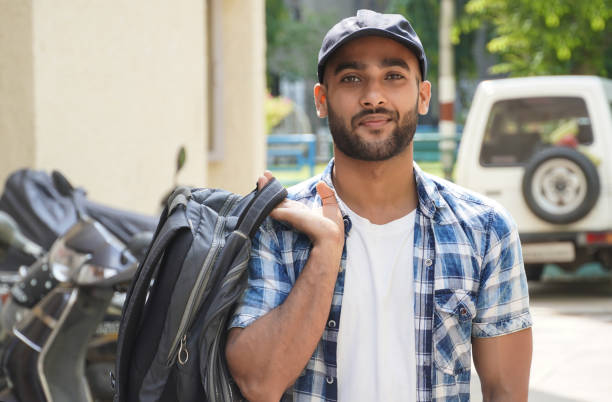 istock a man with bag going for job 1324484604