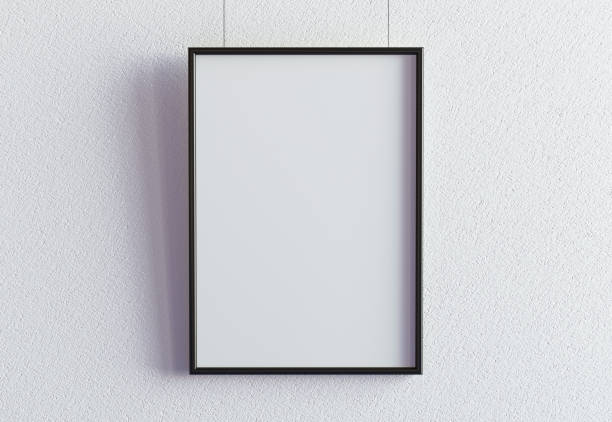 white poster with black frame template on the white wall - staalplaat stockfoto's en -beelden