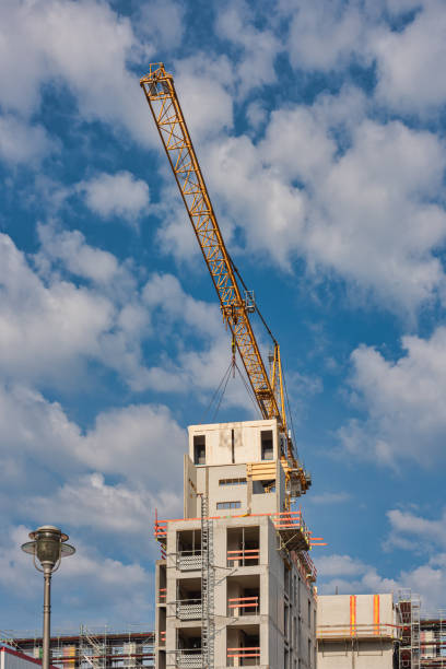 istock Crane lifting a wooden building module to its position in the structure. Construction site of an office building in Berlin. 1324488367