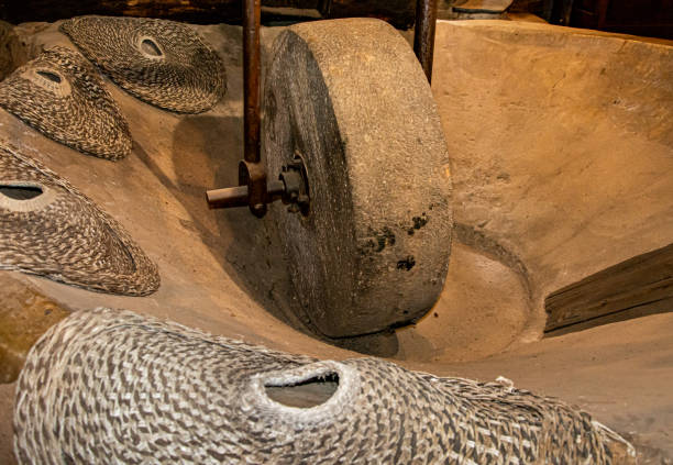 istock Millstone, olive harvesting machinery 1324489134