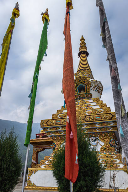 istock buddhist stupa with religious pryer flags and cloudy sky at morning from low angle 1324492394