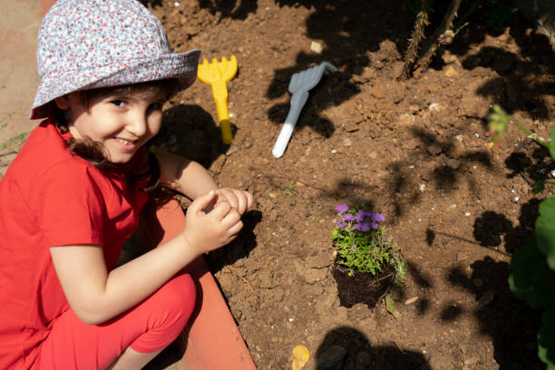 istock Planting Flowers Outside 1324492514