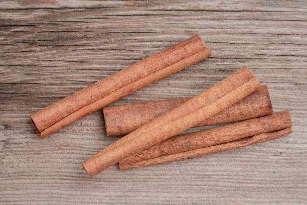 istock dried cinnamon sticks on wooden table with copy space 1324495630