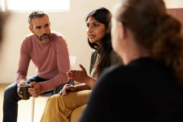 istock A therapist discussing therapy with patients. 1324496069