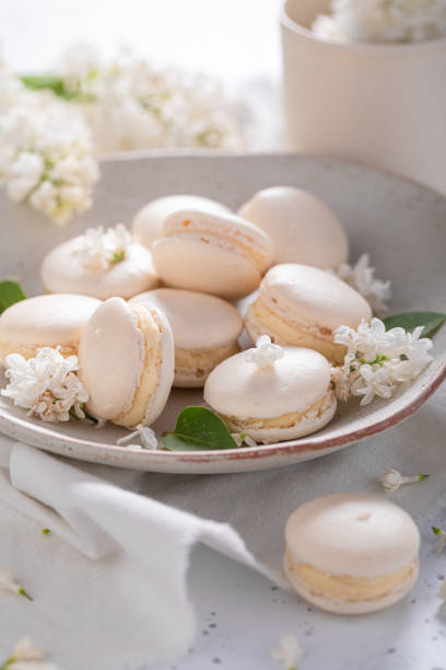 istock Lovely macaroons flavored lilac. Summer dessert composition. 1324497899