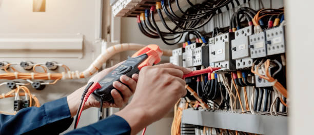 electrician engineer uses a multimeter to test the electrical installation and power line - electrical contractor imagens e fotografias de stock