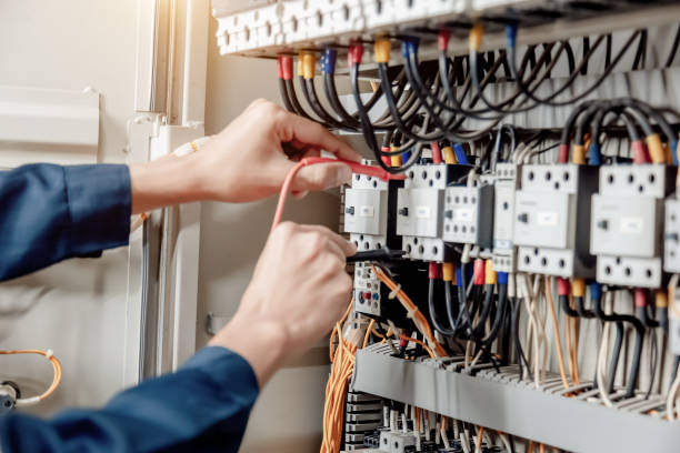 istock Electrician engineer uses a multimeter to test the electrical installation and power line 1324499003
