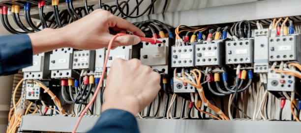 istock Electrician engineer uses a multimeter to test the electrical installation and power line 1324499012