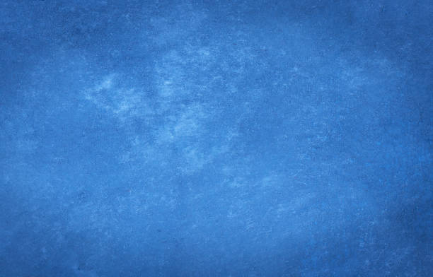 istock Blue decorative plaster texture with vignette. Abstract grunge background with copy space for design. 1324499083
