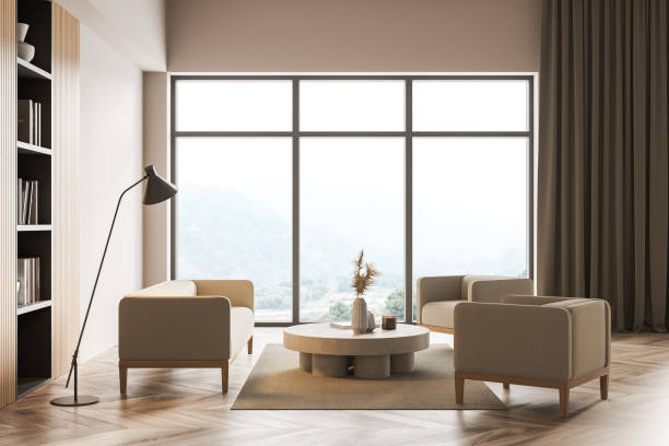 istock Light living room interior with sofa and armchairs, bookshelf and window 1324500020