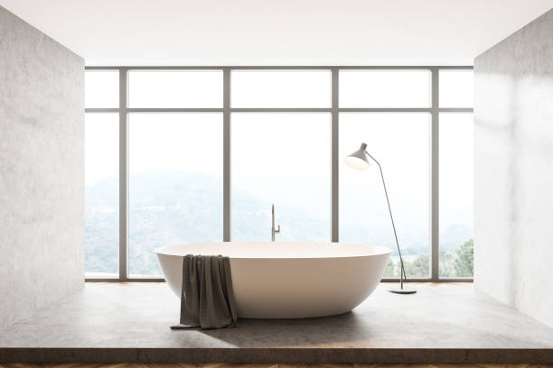 istock Bathroom interior with bathtub, lamp with view on countryside 1324500192