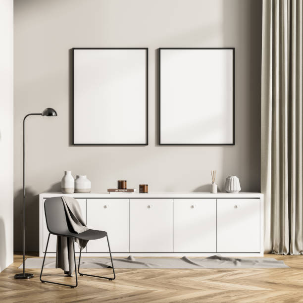 istock Modern design home interior of living room with commode. Mock up frame two posters for painting on the wall. Empty chair. Template. 1324500903