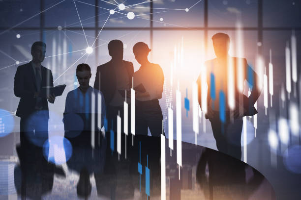 istock Double exposure of businesspeople working with documents at offi 1324500911