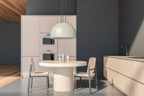 istock Beige kitchen interior with table and chairs on concrete floor 1324501904