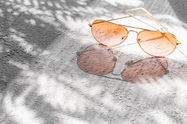 istock Sunglasses with sun shadows . Summer layout. Women's sunglasses. Sun protection. 1324501931