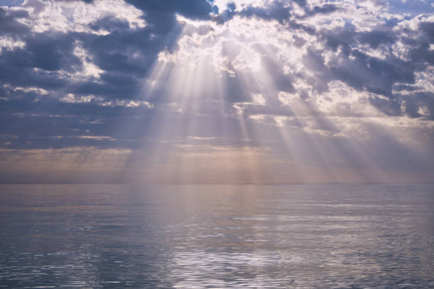istock The Black Sea in the evening with the setting sun. Godrays come from the bright clouds illuminating the scene. Seaside landscapes, sunsets and sunrises, vacation and tourism. 1324502159