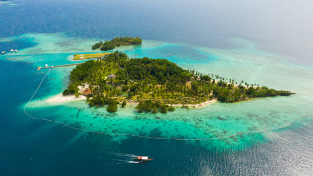 istock Tropical island with beach. Malipano island, Philippines, Samal 1324502229