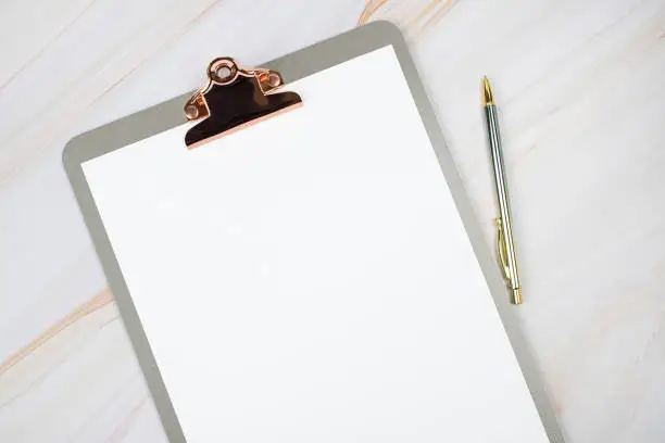 Photo of Clipboard on a marble background