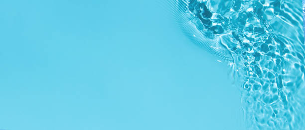 istock transparent blue colored clear calm water surface texture 1324503307