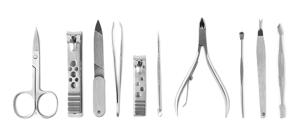 Nail clippers and scissor isolated in white.